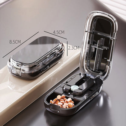 Bärbar pillerburk med skärare